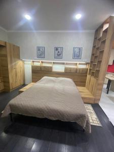 a bedroom with a large bed in a room at Garage Hotel - Old Tbilisi in Tbilisi City
