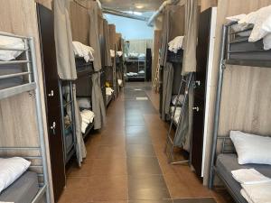 a corridor of a dorm room with bunk beds at better Oh! in Valencia