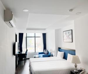 a hotel room with a bed and a desk at HiSea Nha Trang in Nha Trang +138 photos