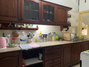 a kitchen with a counter top with lots of clutter at The Sheltuh : Closer to everything Colombo in Manning Town