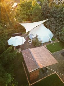 an overhead view of a tent and an umbrella at Lotus Glamping in Tiszalök