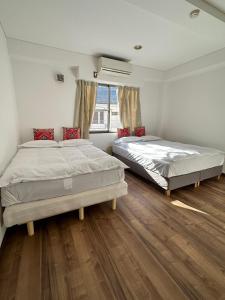 Postel nebo postele na pokoji v ubytování PAThouse台东区店 + 17 fotografií