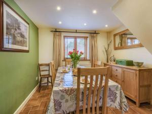 a kitchen and dining room with a table and chairs at 2 bed in Hadleigh 87956 