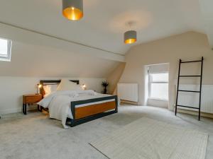 a large bedroom with a bed and a window at 3 Bed in Chapel-En-Le-Frith 88180 in Chapel en le Frith