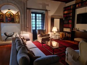 a living room with a couch and a table at Pazo de Villares in Gondomar