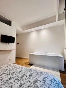 TV a/nebo společenská místnost v ubytování Finella Charming Rooms
