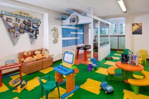 a living room filled with lots of childrens toys at HOTEL AURORA in Cattolica