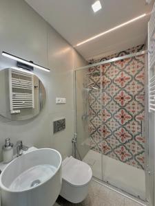 a bathroom with a sink and a toilet and a shower at Al Castello 1 in Riomaggiore +67 photos
