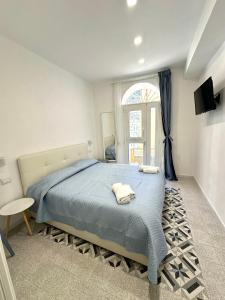 Postel nebo postele na pokoji v ubytování Al Castello 1 + 37 fotografií