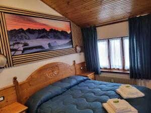 Postel nebo postele na pokoji v ubytování Albergo Meuble Tarandan