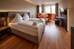 Un pat sau paturi într-o cameră la Hotel Soho