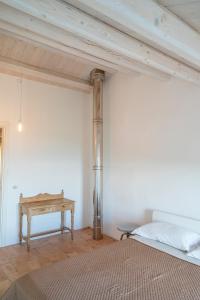 A bed or beds in a room at A26 - Poggio, cielo-terra con vista mare mozzafiato