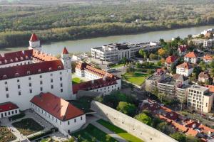 an aerial view of a city with a river and buildings at BNB Slovakia Royal City Vista Apartment in Bratislava