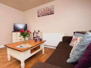 a living room with a coffee table and a couch at 1 bed in Burnham-on-Sea ALOLD in Highbridge