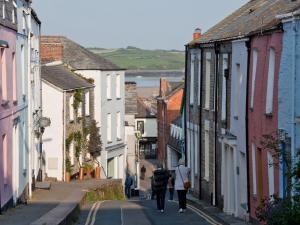 a group of people walking down a street at 2 Bed in Wadebridge QUILL in Saint Tudy