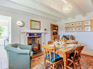 a living room with a table and a fireplace at 3 bed in Helmsdale SU192 in Helmsdale