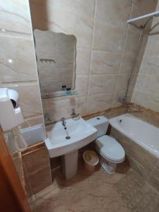 a bathroom with a sink and a toilet and a tub at GOLDEN MINARET by Terrace in Bukhara
