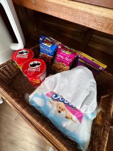 a basket of dog food and snacks on a shelf at Lhong Chiang Dao Glamping หลงเชียงดาว in Chiang Dao