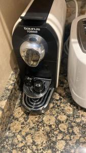 a coffee maker sitting on top of a counter at Bel appart wifi balcon et parking Marrakech centre in Marrakesh