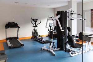 a gym with two tread machines and a treadmill at Bonjur Hotel Thermal & Wellness Club in Ankara