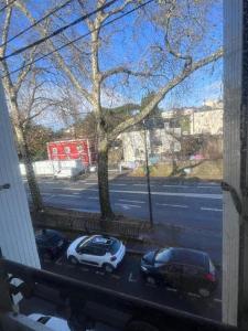 a view of a street with cars parked outside a window at Studio neuf au calme proche gare maritime - 7 min in Nantes