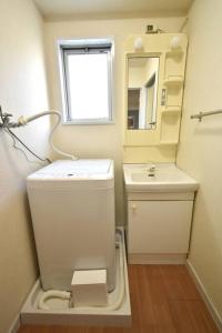 Ванная комната в ゆったり1LDKで最大8人まで宿泊可能！博多駅・キャナルも徒歩圏内！コンビニ・スーパー徒歩１分！