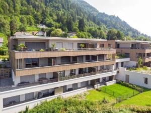 an aerial view of a building with a mountain at Bella Vista Seeblick in Annenheim