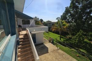 a porch of a house with stairs and a yard at Inviting 3-Bed Apt in Whim Estate- nearScarborough in Scarborough