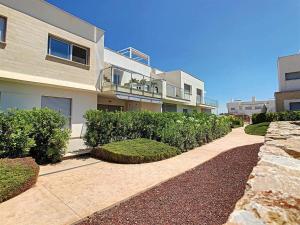 a large house with bushes and a walkway at Nuestro Sueño in Orihuela Costa