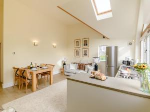 a kitchen and a living room with a table at 1 Bed in Turnditch PK919 in Turnditch