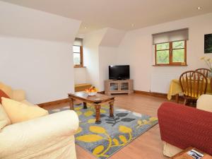 a living room with a couch and a table at 2 bed in Petham 55811 in Waltham