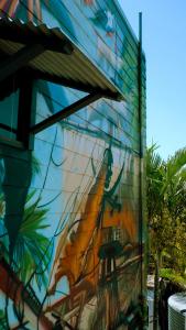 a mural of a ship on the side of a building at Backpackers at 1770 in Agnes Water