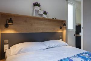 Postel nebo postele na pokoji v ubytování Camping Piantelle