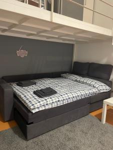 Postelja oz. postelje v sobi nastanitve Milo-metro Loft