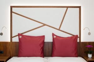A bed or beds in a room at Hotel Campagnola