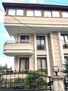 a large building with a balcony in front of it at Halic Apart Hotel in Yalova