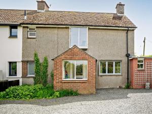 a brick house with white windows and a driveway at 3 Bed in Nr Embleton CN156 in North Charlton
