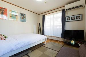 Krevet ili kreveti u jedinici u okviru objekta 2S JR Yamanote Komagome, 3 storey 101sq 4BR, FreePark