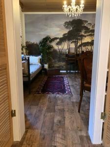 a hallway with a living room with a painting on the wall at Villa Adlon in Hochheim am Main