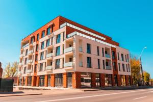 a brick building on the side of a street at Central Residence in Baia Mare