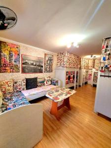 a room with a table in the middle of a store at Hostel Amazing Ionika CenterCity in Chişinău