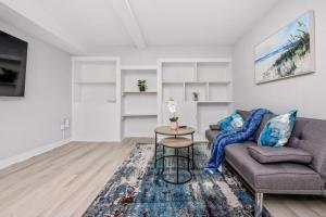 a living room with a couch and a table at CenterStreet-Cozy 2bedroomSuite in Calgary