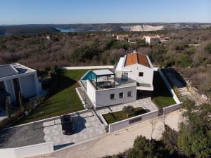 an aerial view of a white house at Villa Lea near Rabac with sea view only 1,5 km from the beach in Diminići