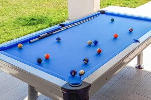 a blue pool table with balls on it at Villa Dora in Central Istria kids friendly with private pool and playground for 10 persons in Svetvinčenat