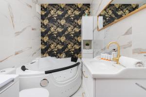a bathroom with a toilet and a sink at Batorego 7 Apartament with Terrace & Parking Downtown Gdynia by Renters in Gdynia