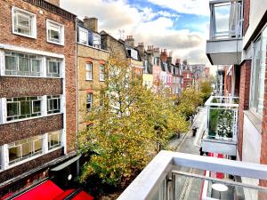 a view of a city street from a balcony at A Gem Next to Selfridges in London