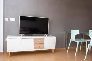 Televízia a/alebo spoločenská miestnosť v ubytovaní 4-Seasons Penthouse Cullera