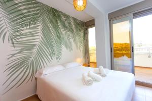 Postel nebo postele na pokoji v ubytování 4-Seasons Penthouse Cullera