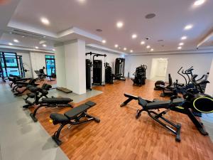 a gym with a bunch of treadmills and exercise bikes at New 2 bedroom entire apartment in Madinat Jumeirah Living in Dubai
