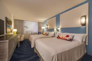 Cama ou camas em um quarto em Universal's Loews Sapphire Falls Resort mais 16 fotos